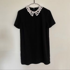 Black mini dress with lace collar